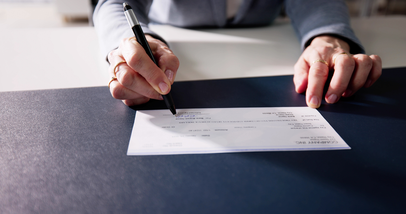 Woman endorsing a check